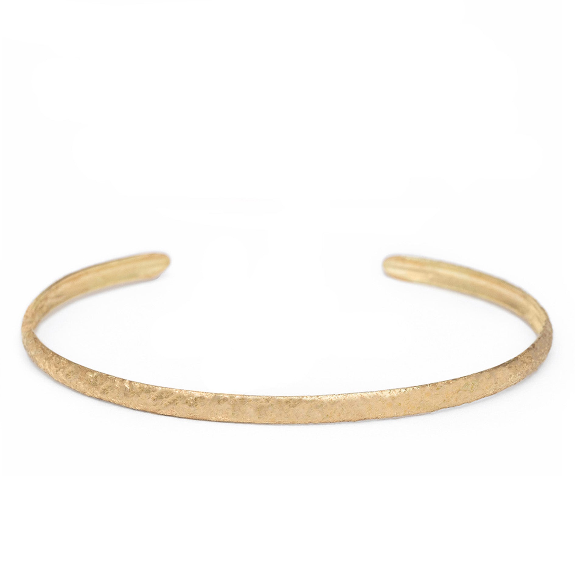 Gold bracelet bangle on a white background