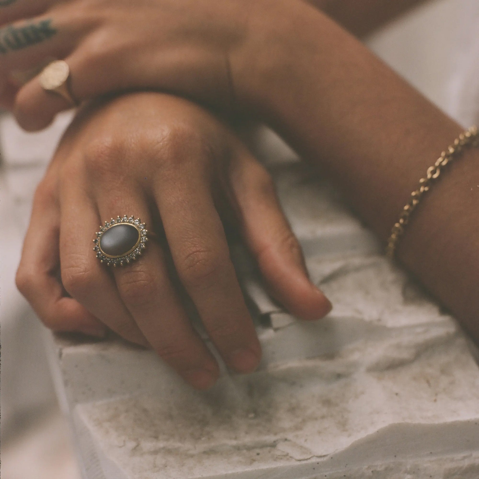 maya selway tilda moonstone cocktail ring on a model. edgy contemporary alternative fine jeweller