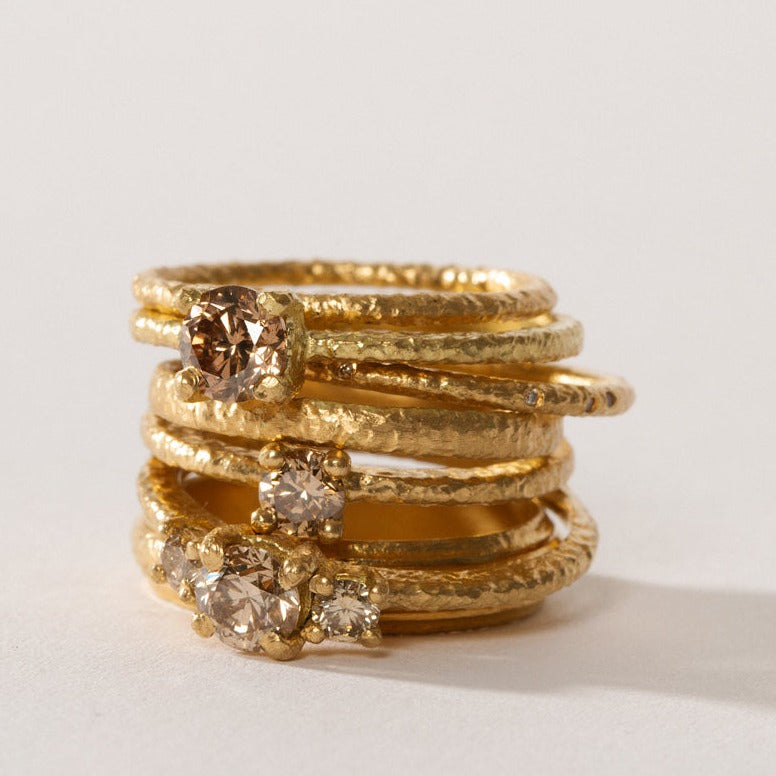 maya selway fine jewellery still life, stack of 18ct yellow gold and diamond rings