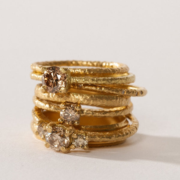 maya selway fine jewellery still life, stack of 18ct yellow gold and diamond rings