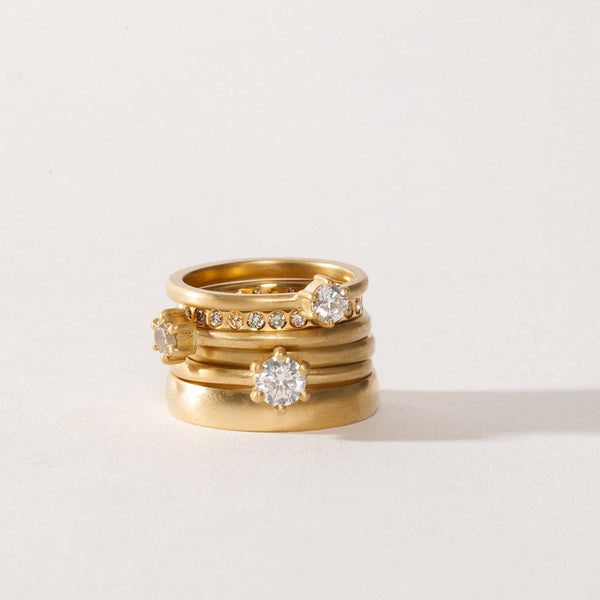 maya selway fine jewellery still life, stack of many textured and matte 18ct yellow gold and diamond rings