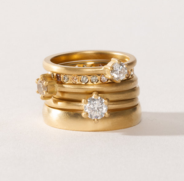 maya selway fine jewellery still life, stack of matte 18ct yellow gold and diamond rings