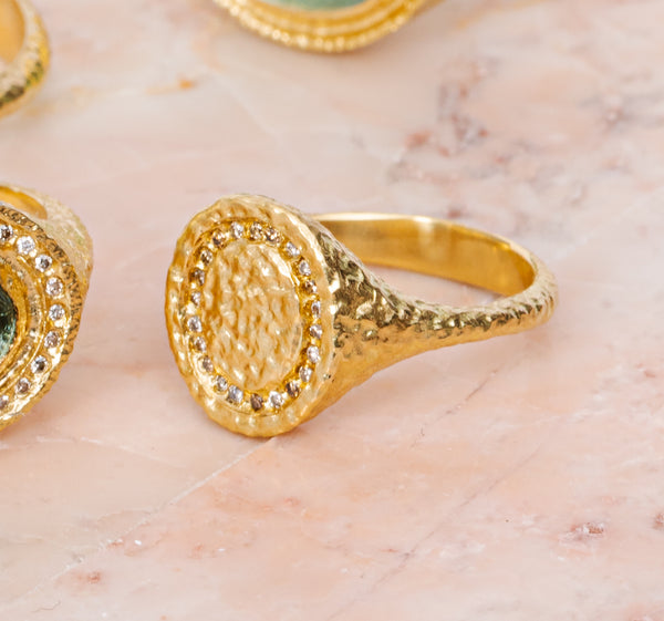 maya selway fine jewellery still life, scattering of textured 18ct yellow gold and diamond rings