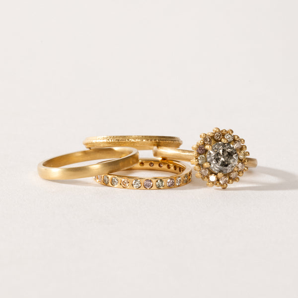 maya selway fine jewellery still life, scattering of textured and matte 18ct yellow gold and diamond rings